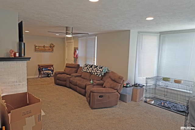 living room featuring recessed lighting, ceiling fan, carpet, and a textured ceiling