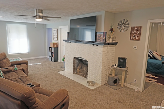 carpeted living area with a brick fireplace, baseboards, ceiling fan, and a textured ceiling