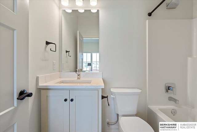 full bathroom featuring vanity, bathtub / shower combination, and toilet