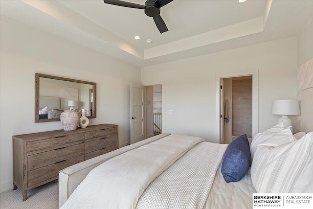 bedroom featuring recessed lighting, a ceiling fan, and a raised ceiling