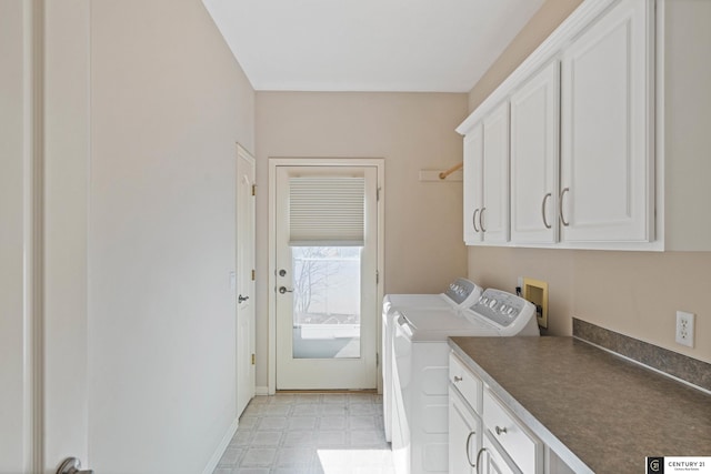 laundry area featuring cabinet space, washer and dryer, and light floors