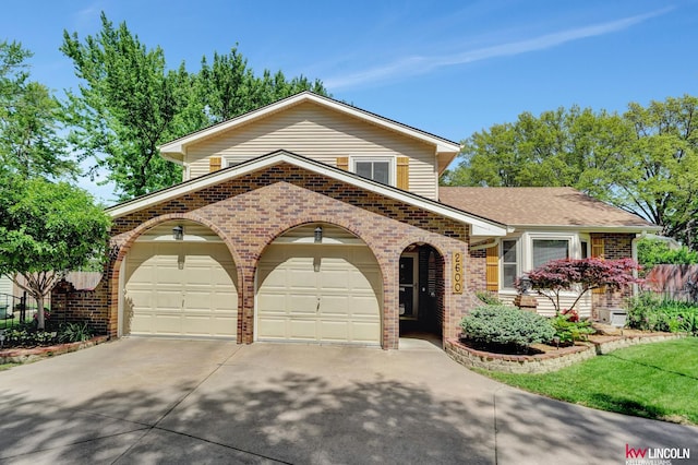 view of front of property with brick siding, concrete driveway, and an attached garage