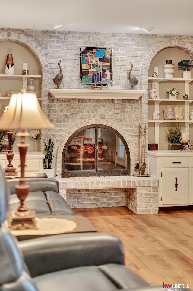 sitting room featuring wood finished floors and a fireplace