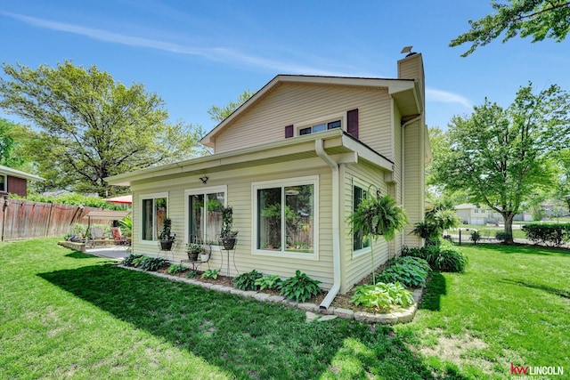 view of front of house with a chimney and a patio area