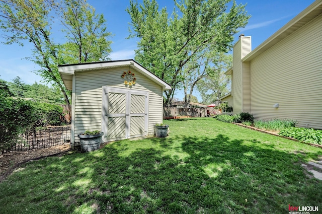 view of yard with a storage shed and an outdoor structure