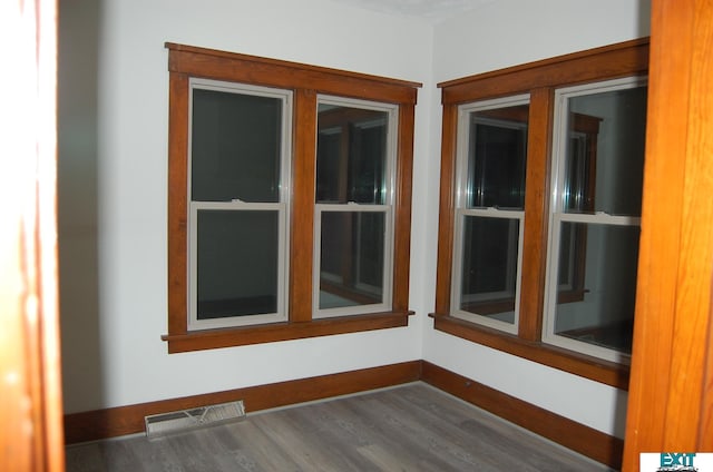405 E 5th St, Mccook, NE 69001 - spare room with visible vents, baseboards, and wood finished floors