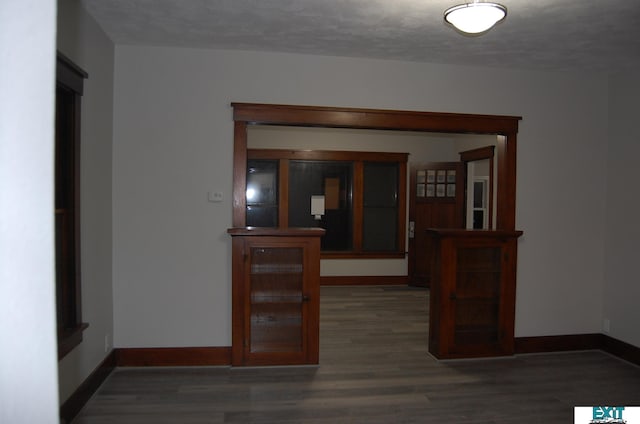 405 E 5th St, Mccook, NE 69001 - spare room with baseboards, a textured ceiling, and wood finished floors