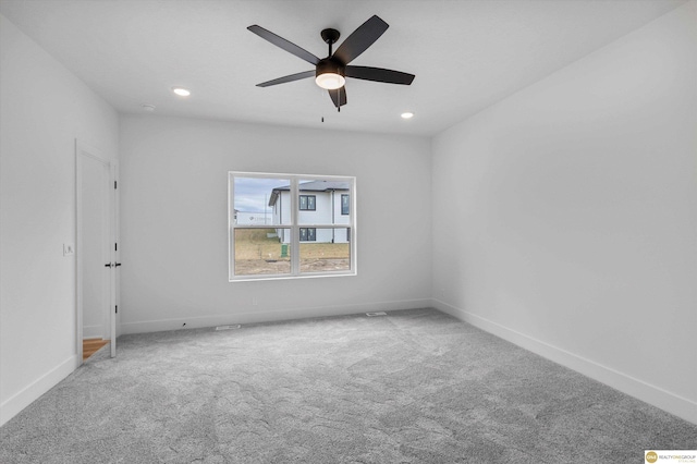 empty room featuring baseboards, carpet flooring, recessed lighting, and a ceiling fan