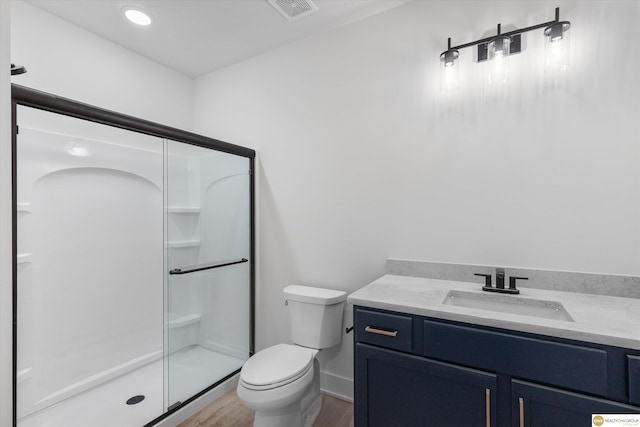 full bathroom with a stall shower, visible vents, wood finished floors, and toilet
