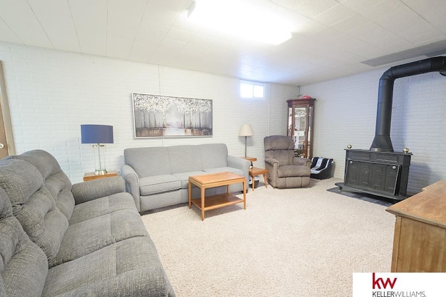 carpeted living room featuring a wood stove