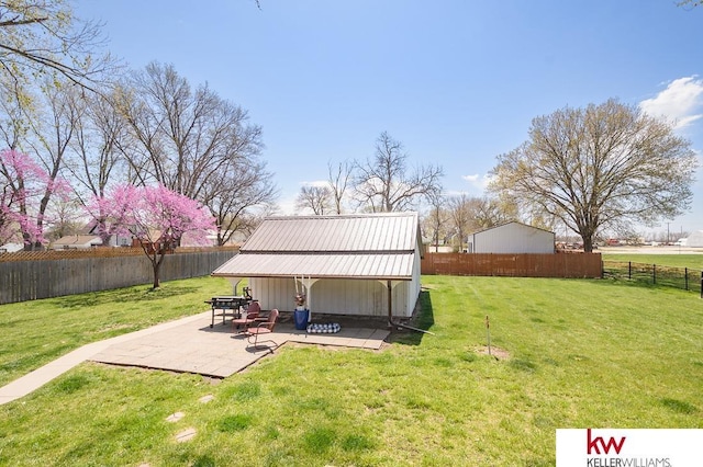 view of yard with a fenced backyard and a patio