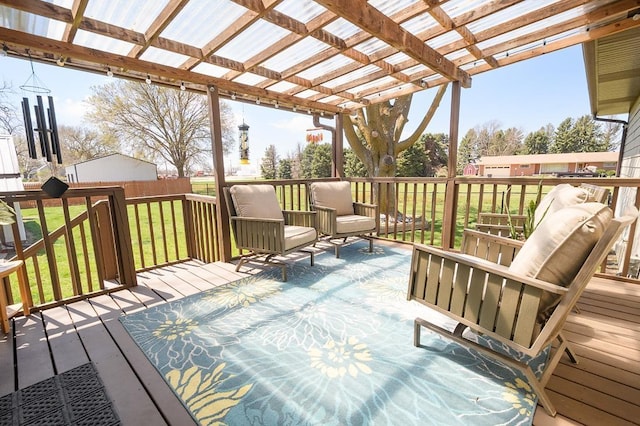 wooden deck with a pergola and a lawn