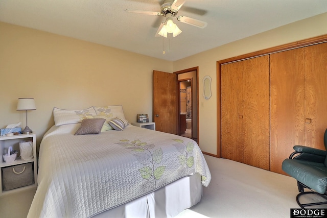 bedroom with ceiling fan, a closet, and carpet floors