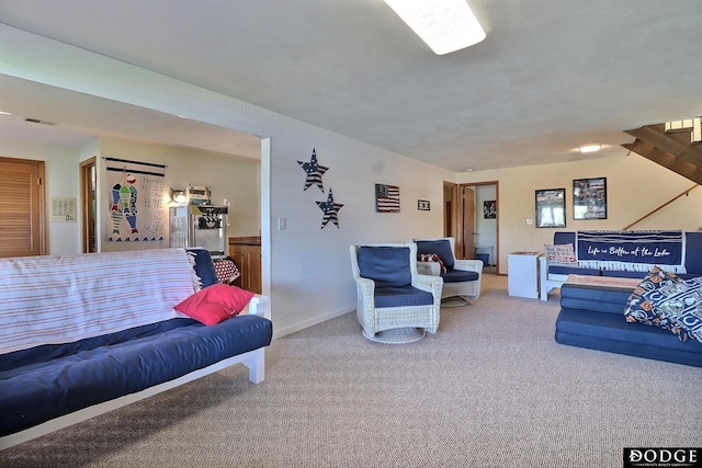 living area featuring visible vents and carpet floors