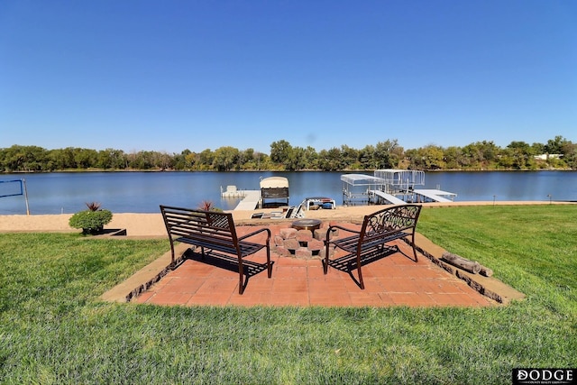 exterior space with a water view, a patio area, and a yard