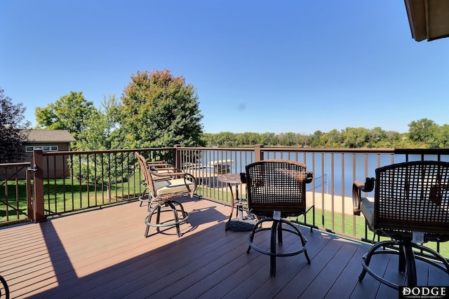 deck featuring a water view