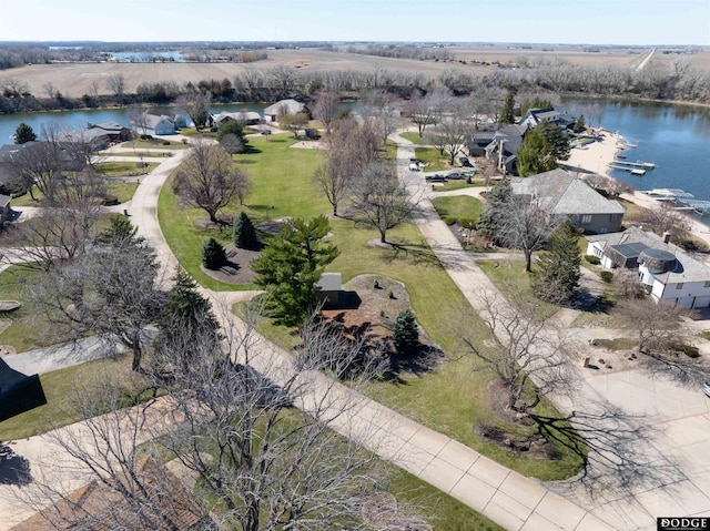 drone / aerial view featuring a residential view and a water view