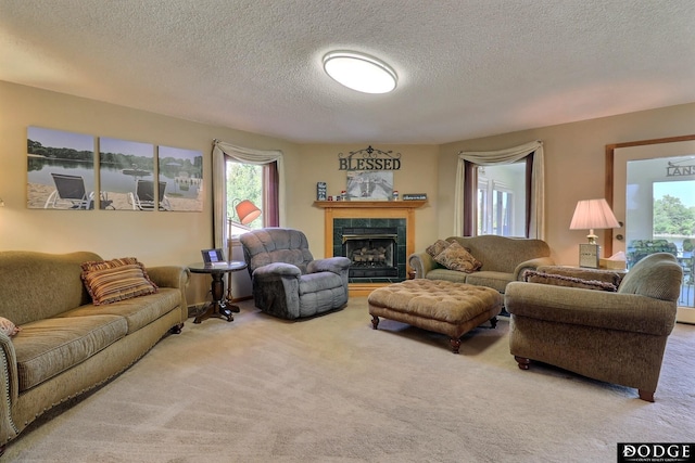 living area with a textured ceiling, carpet, and a premium fireplace