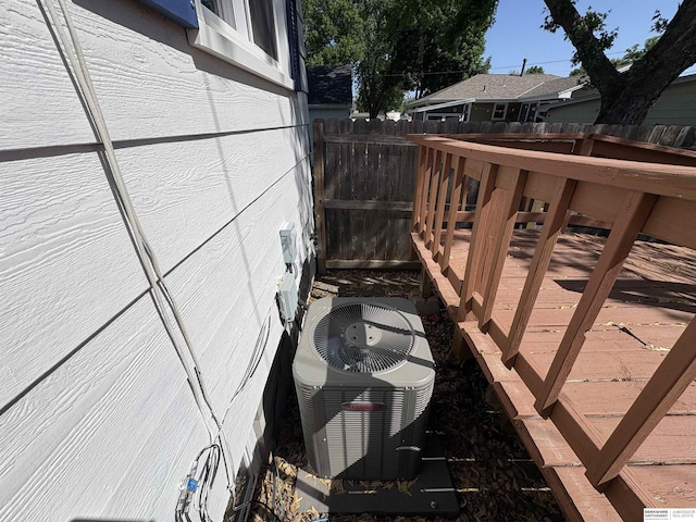1626 N C St, Fremont, NE 68025 - wooden terrace with fence and central AC unit
