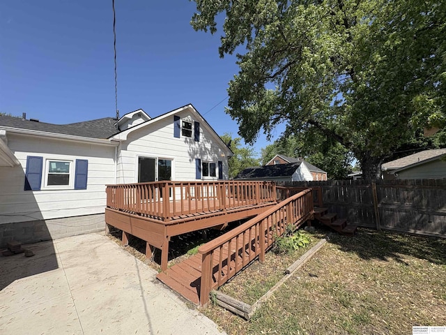 1626 N C St, Fremont, NE 68025 - rear view of property with fence and a wooden deck