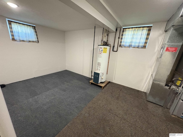 1626 N C St, Fremont, NE 68025 - finished basement featuring water heater and dark colored carpet