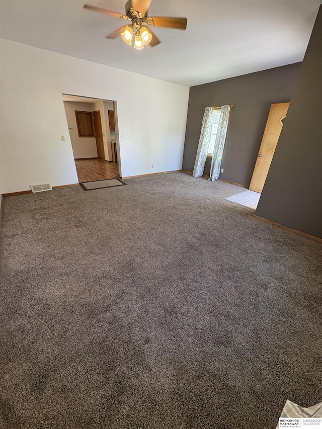 1626 N C St, Fremont, NE 68025 - spare room featuring ceiling fan, carpet floors, and baseboards