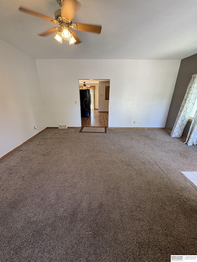 1626 N C St, Fremont, NE 68025 - carpeted spare room featuring a ceiling fan and baseboards