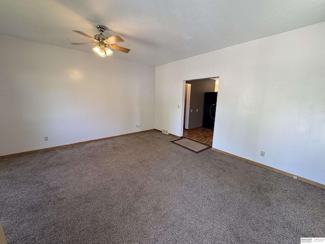 1626 N C St, Fremont, NE 68025 - carpeted empty room with a ceiling fan and baseboards