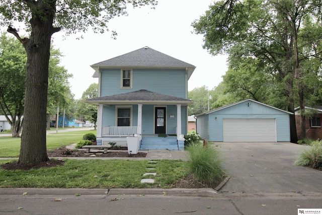 view of front facade with an outdoor structure, a front lawn, a porch, a garage, and a shingled roof