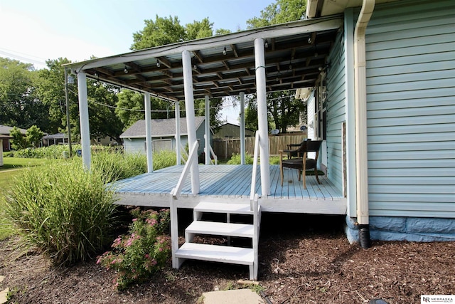 wooden terrace with an outdoor structure