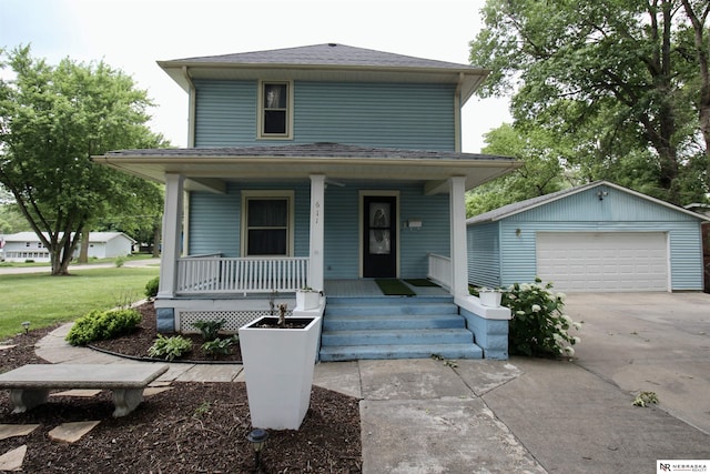 traditional style home featuring covered porch, an outbuilding, a shingled roof, and a detached garage