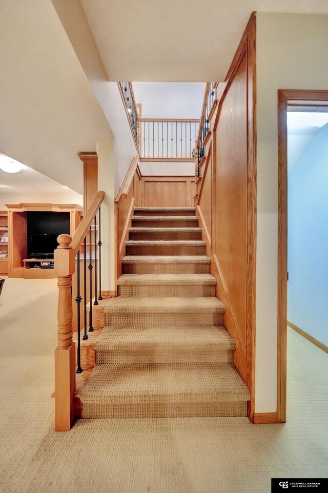 staircase with carpet and baseboards