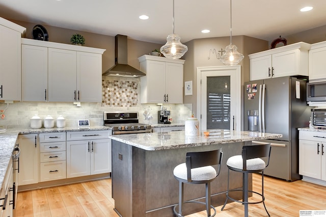 8914 N 171st St, Bennington, NE 68007 - kitchen featuring wall chimney exhaust hood, appliances with stainless steel finishes, light wood-style floors, decorative backsplash, and white cabinetry