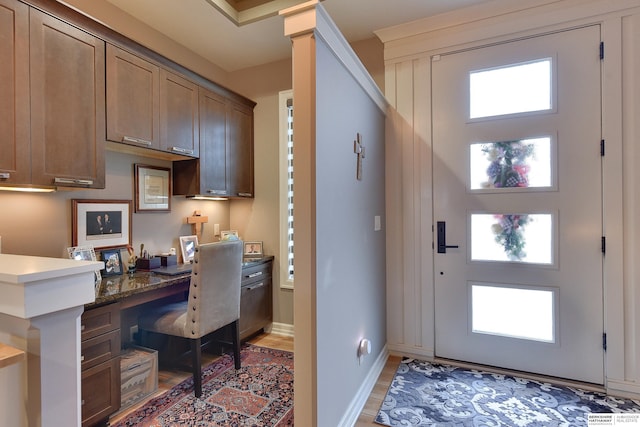 8914 N 171st St, Bennington, NE 68007 - home office with built in study area, light wood finished floors, and baseboards