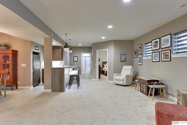 8914 N 171st St, Bennington, NE 68007 - living room with recessed lighting, light carpet, and baseboards