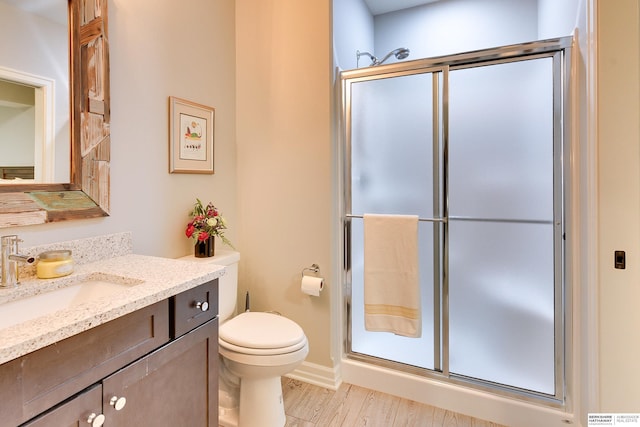 8914 N 171st St, Bennington, NE 68007 - bathroom with vanity, a stall shower, toilet, and wood finished floors