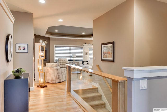 8914 N 171st St, Bennington, NE 68007 - stairway with wood finished floors, recessed lighting, a tray ceiling, and baseboards