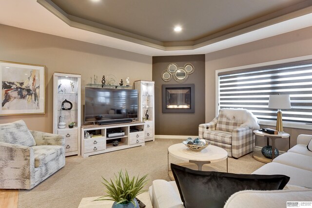 8914 N 171st St, Bennington, NE 68007 - living area featuring a raised ceiling, carpet flooring, and baseboards