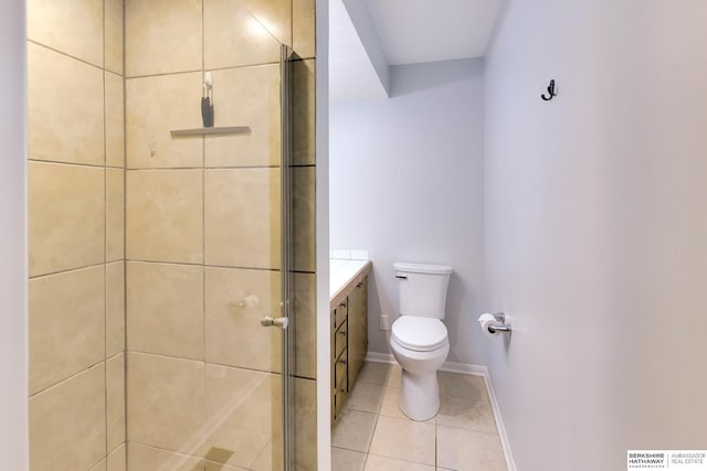 bathroom featuring baseboards, tile patterned flooring, a stall shower, and toilet