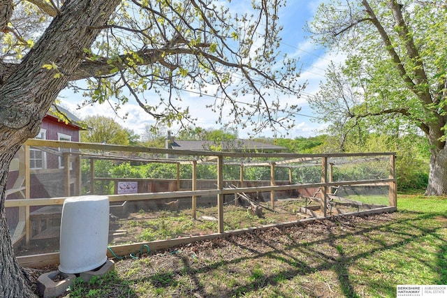 view of yard with exterior structure and an outbuilding