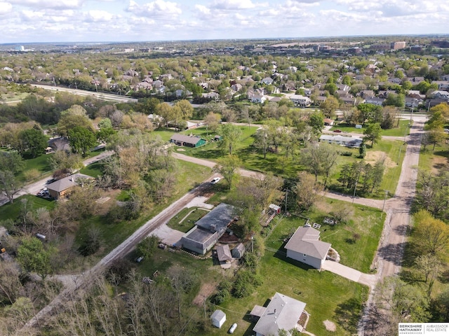 birds eye view of property with a residential view
