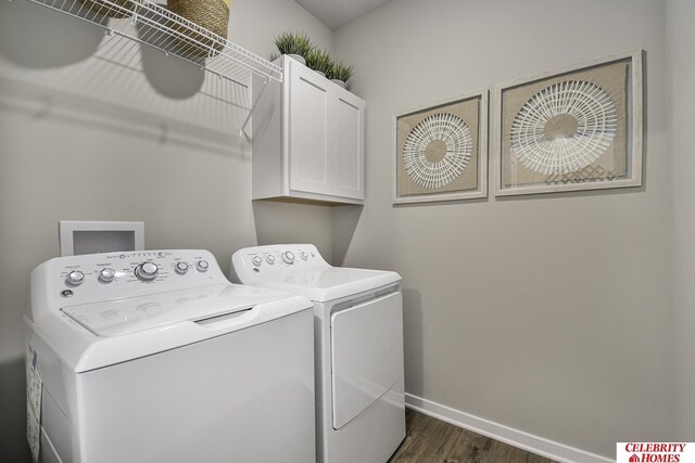 laundry area featuring baseboards, cabinet space, dark wood-style floors, and independent washer and dryer
