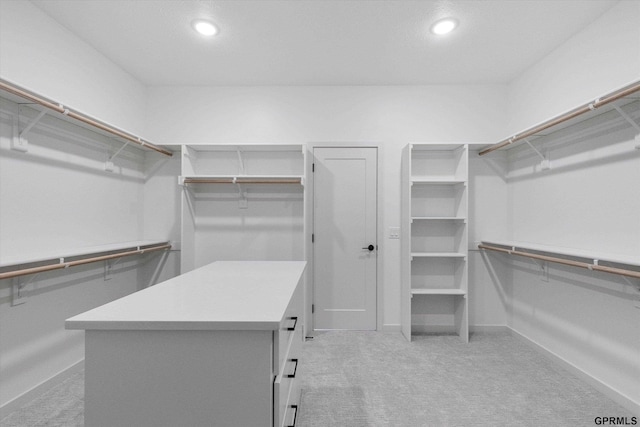 spacious closet with carpet floors