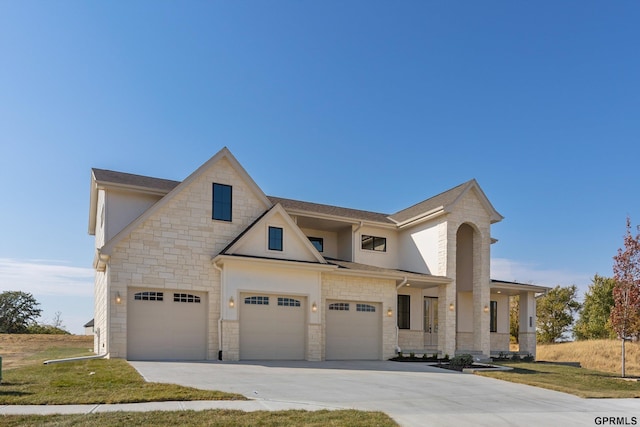 view of front of house with driveway, stone siding, stucco siding, a front lawn, and a garage