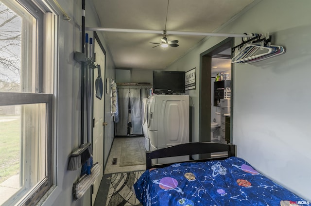 bedroom featuring washing machine and dryer