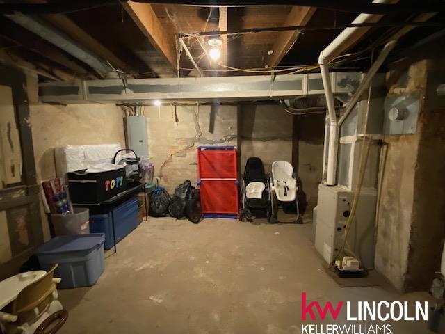 unfinished below grade area with electric panel