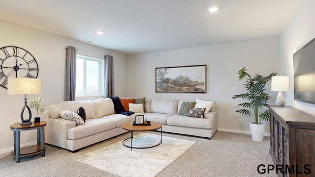 living area featuring carpet flooring, baseboards, and recessed lighting