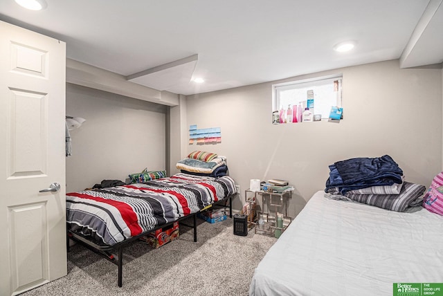 carpeted bedroom with recessed lighting