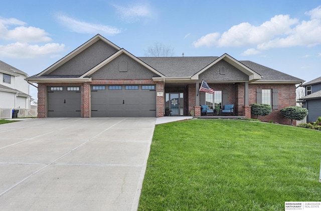 8153 Swallowtail St, Papillion, NE 68046 - view of front of house featuring a front lawn, brick siding, an attached garage, driveway, and roof with shingles