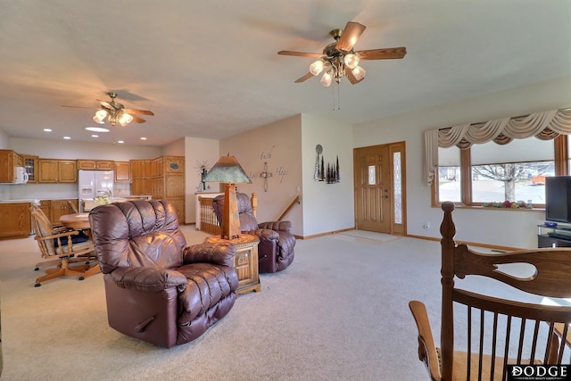 living area with ceiling fan, recessed lighting, light colored carpet, and baseboards